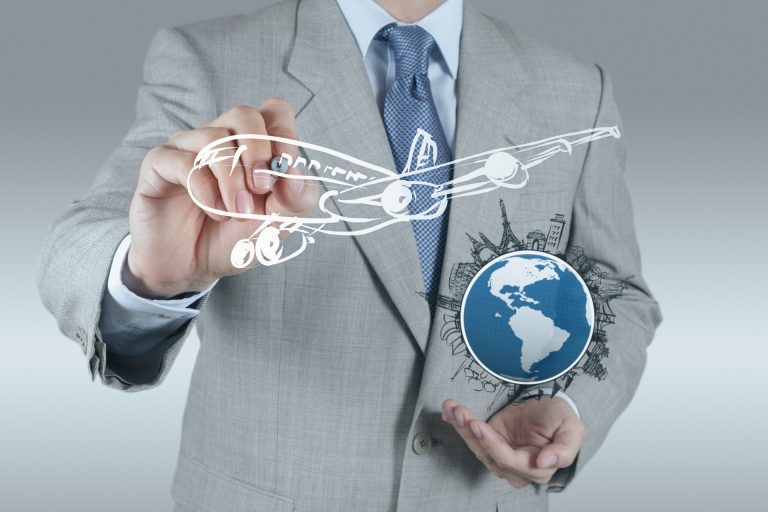 businessman  draws dream travel around the world